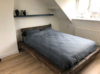donker eikenhouten bed